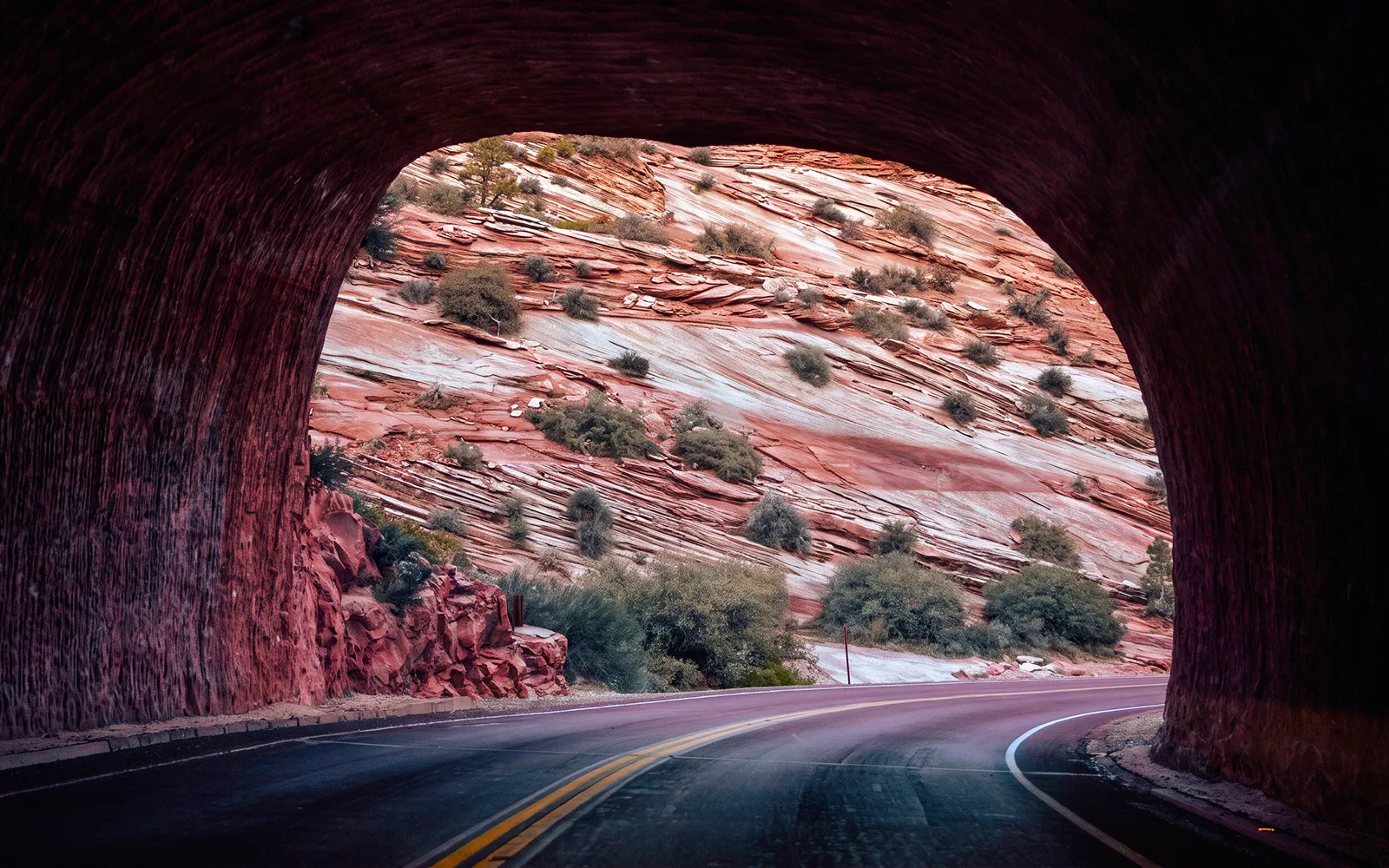 Tunnel view of red rock formations on Bryce & Zion Luxury Boutique Scenic Tour.