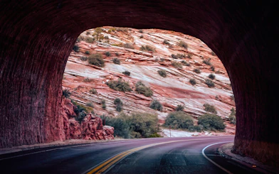 Tunnel view of red rock formations on Bryce & Zion Luxury Boutique Scenic Tour.