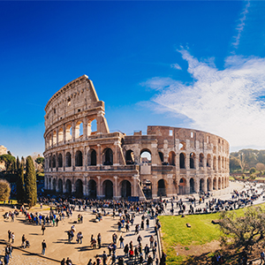 Colosseum in Rome with tourists exploring the ancient amphitheater.