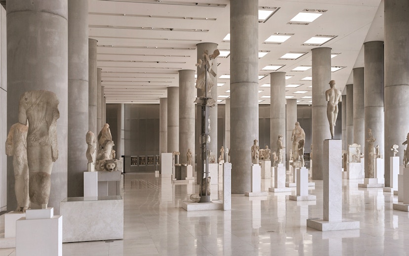 Ancient sculptures in the Athens Acropolis Museum exhibit hall.