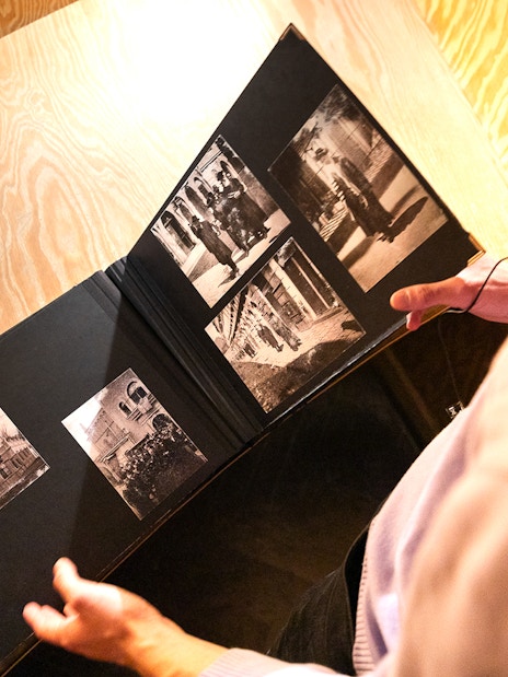Photo album with historical images at Oskar Schindler's Factory entrance.