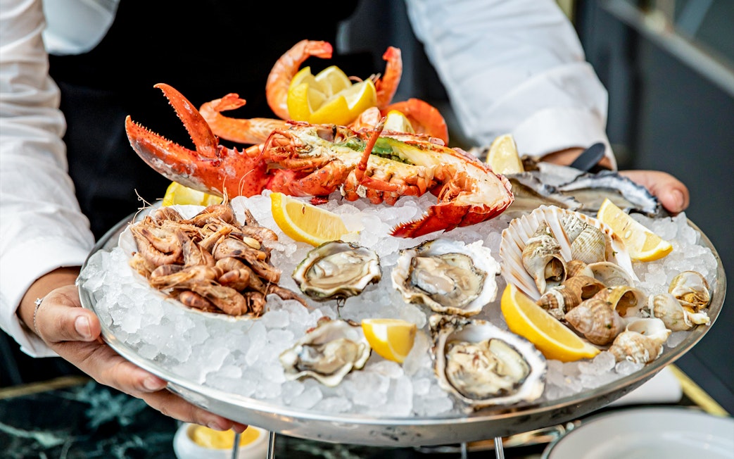 Seafood platter with lobster, oysters, shrimp, and lemon at Brasserie Rosalie.