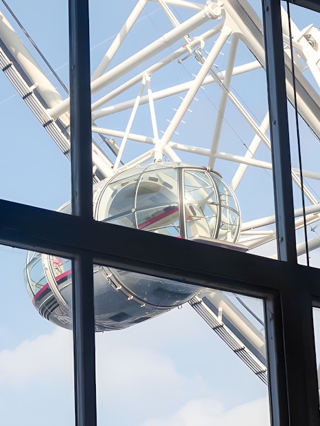 London Eye capsule viewed through County Hall window.