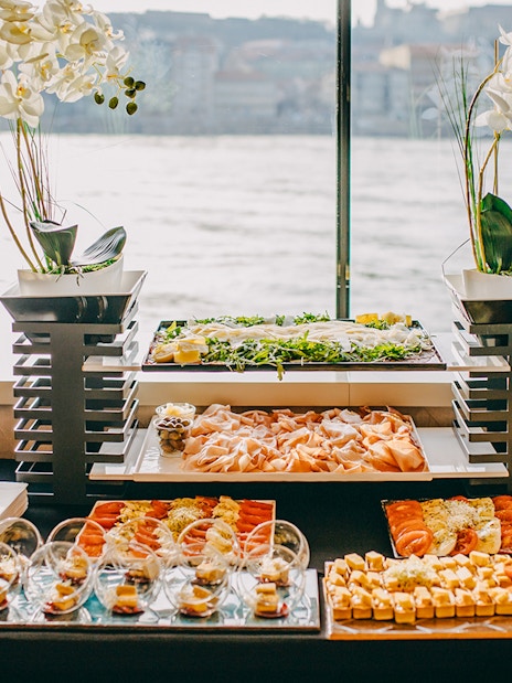 Buffet spread on New Year's Eve dinner cruise with assorted appetizers and bread.
