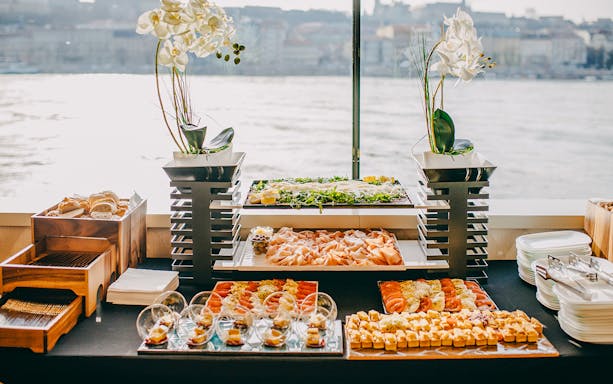 Buffet spread on New Year's Eve dinner cruise with assorted appetizers and bread.