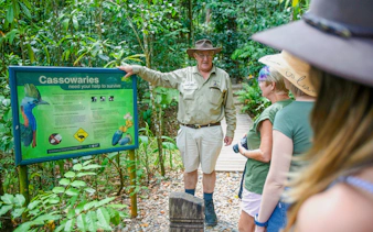 Guide explaining cassowary conservation at Daintree Rainforest, part of the Great Barrier Reef tour.