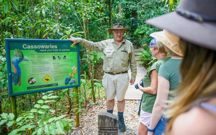 Guide explaining cassowary conservation at Daintree Rainforest, part of the Great Barrier Reef tour.