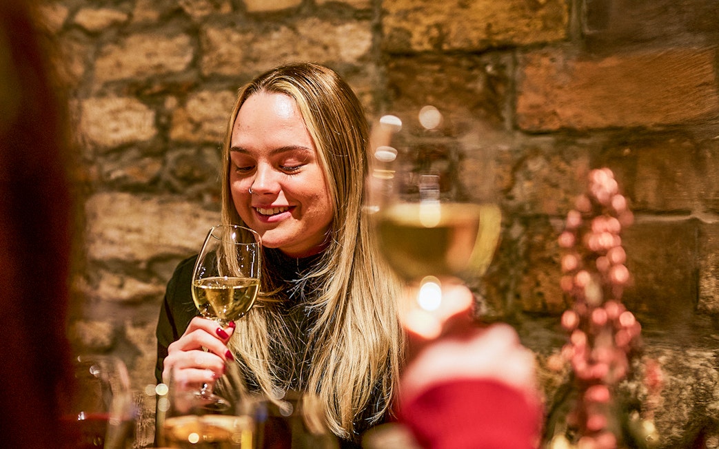 Guests enjoying wine tasting at Budapest GastroCellar.