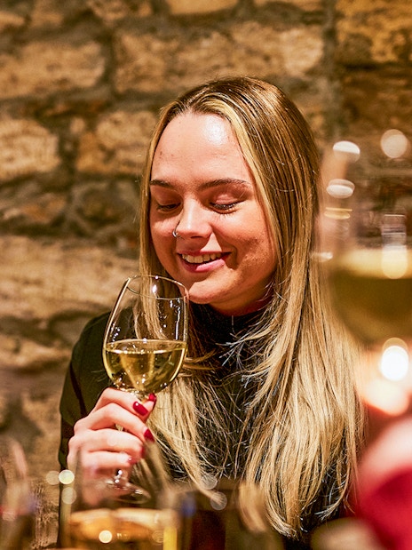 Guests enjoying wine tasting at Budapest GastroCellar.