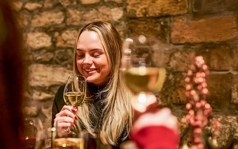 Guests enjoying wine tasting at Budapest GastroCellar.