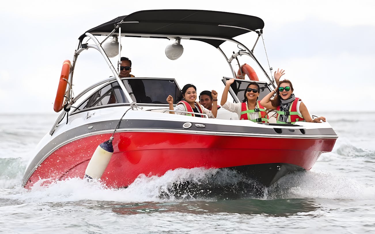 Group enjoying a speedboat ride to Paradise 101 private island adventure.