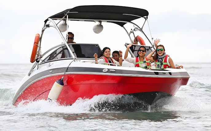 Group enjoying a speedboat ride to Paradise 101 private island adventure.