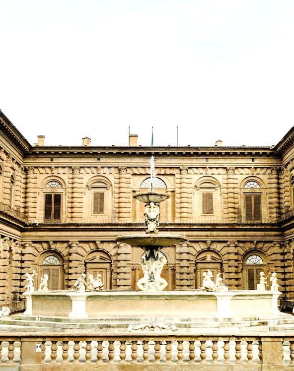 Palazzo Pitti courtyard with ornate fountain, Florence, Italy.