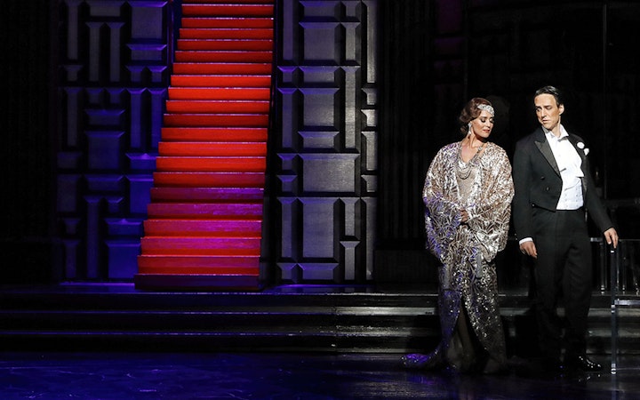 Theatrical performance of The Merry Widow in Sydney with actors in formal attire.