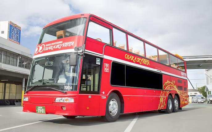 Open-top red double-decker bus for Osaka Sky Vista sightseeing tour.