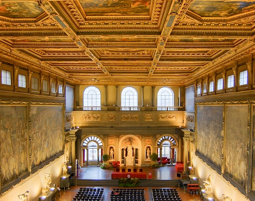 Palazzo Vecchio interior with ornate ceiling and large frescoes, Florence, Italy.