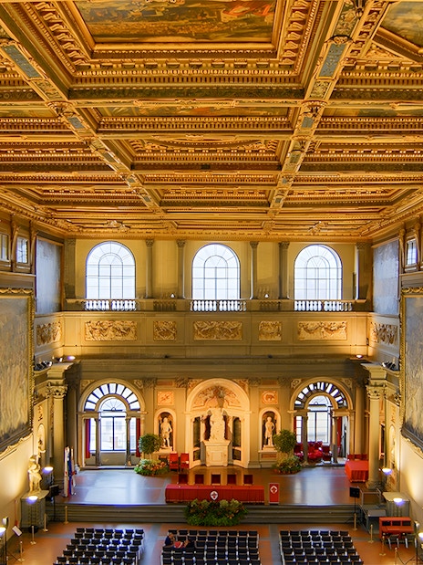 Palazzo Vecchio interior with ornate ceiling and large frescoes, Florence, Italy.