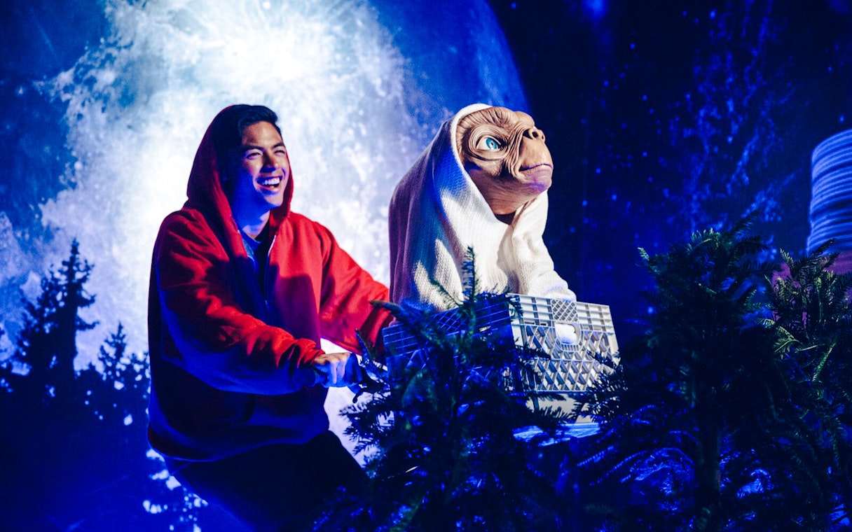 Man with ET statue on bicycle at Madame Tussauds Hollywood.