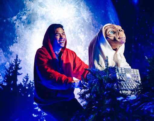 Man with ET statue on bicycle at Madame Tussauds Hollywood.