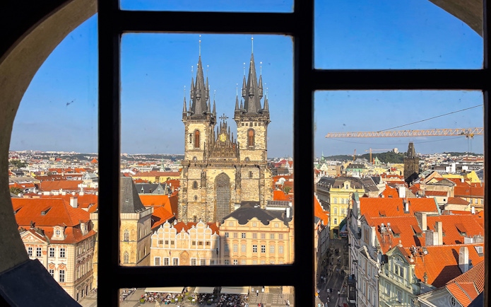 View of Church of Our Lady before Týn through a window in Prague, Czech Republic.