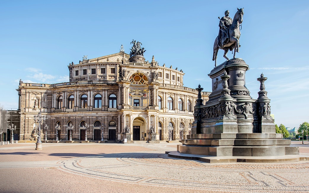 Semper Opera House in Dresden with equestrian statue in foreground.