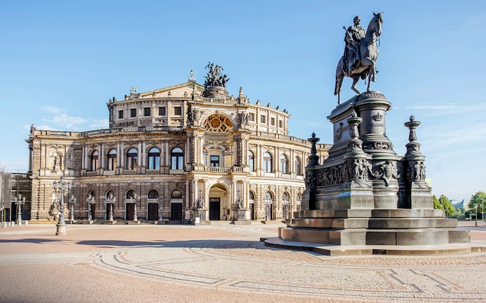 Semper Opera House in Dresden with equestrian statue in foreground.
