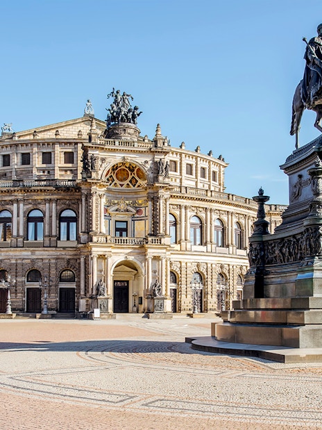 Semper Opera House in Dresden with equestrian statue in foreground.