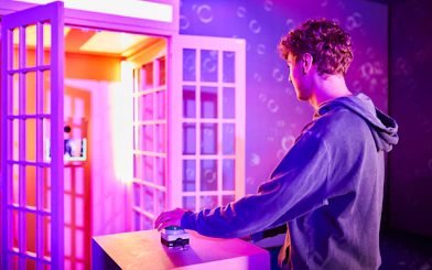 Person interacting with an exhibit at Bubble Planet, Washington DC.