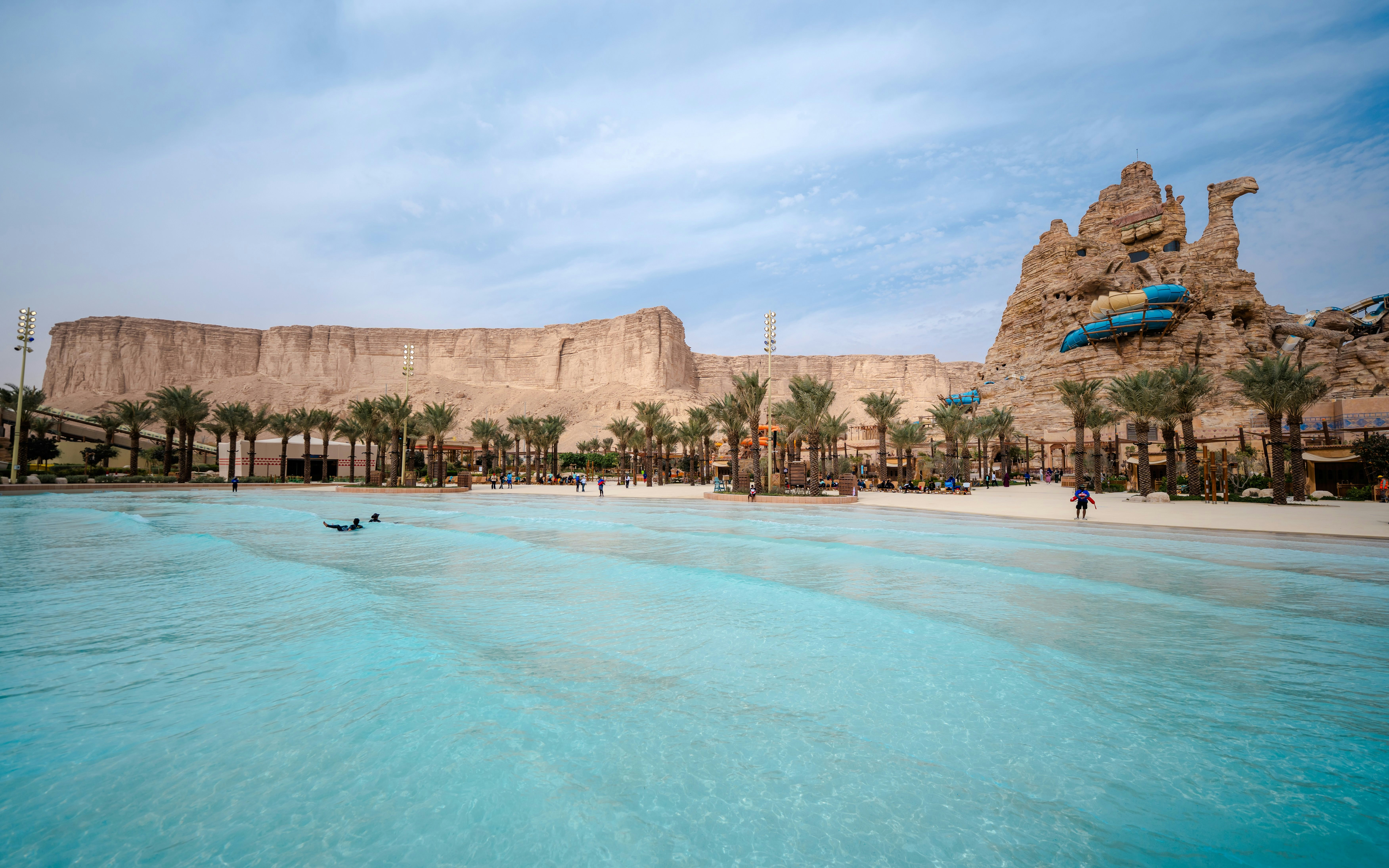 Surftopia wave pool and rock formations at Aquarabia Water Theme Park, Qiddiya City, Saudi Arabia.