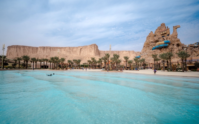 Surftopia wave pool and rock formations at Aquarabia Water Theme Park, Qiddiya City, Saudi Arabia.
