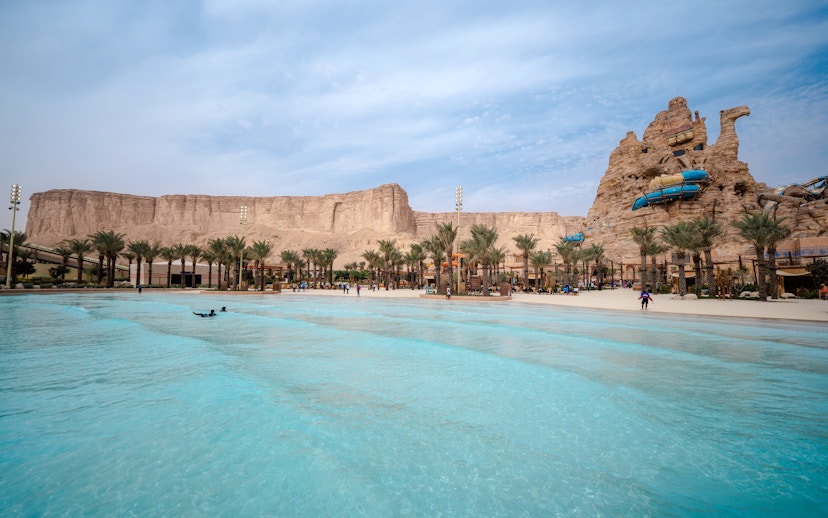 Surftopia wave pool and rock formations at Aquarabia Water Theme Park, Qiddiya City, Saudi Arabia.