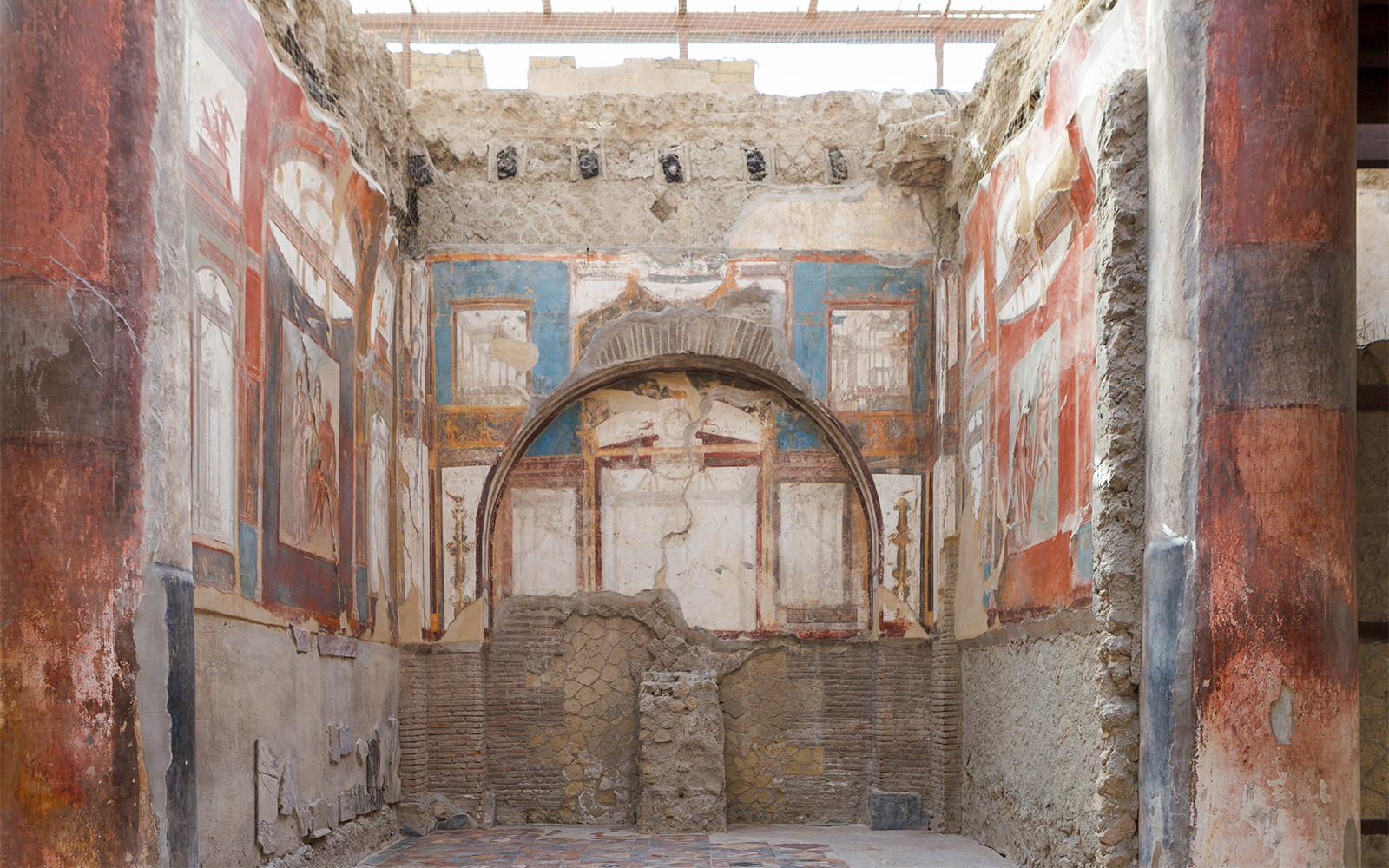 Ancient frescoes and ruins inside a building in Herculaneum, Italy.