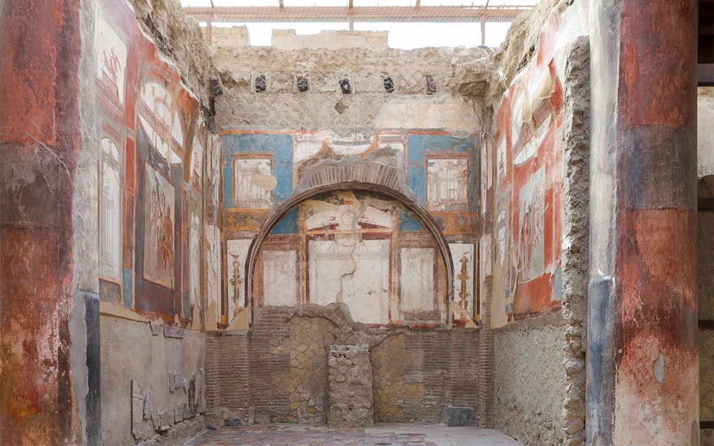 Ancient frescoes and ruins inside a building in Herculaneum, Italy.