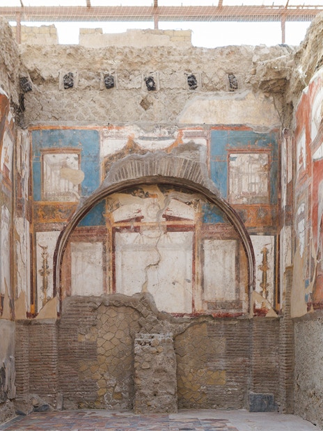 Ancient frescoes and ruins inside a building in Herculaneum, Italy.