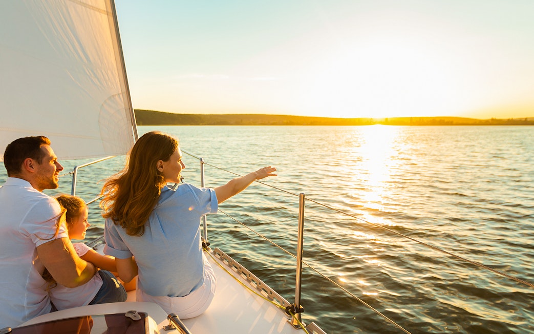 Family enjoying sunset cruise on Gdansk River with Prosecco.