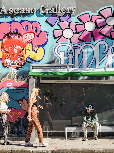 Wynwood Walls Miami bus stop with vibrant mural and graffiti art.
