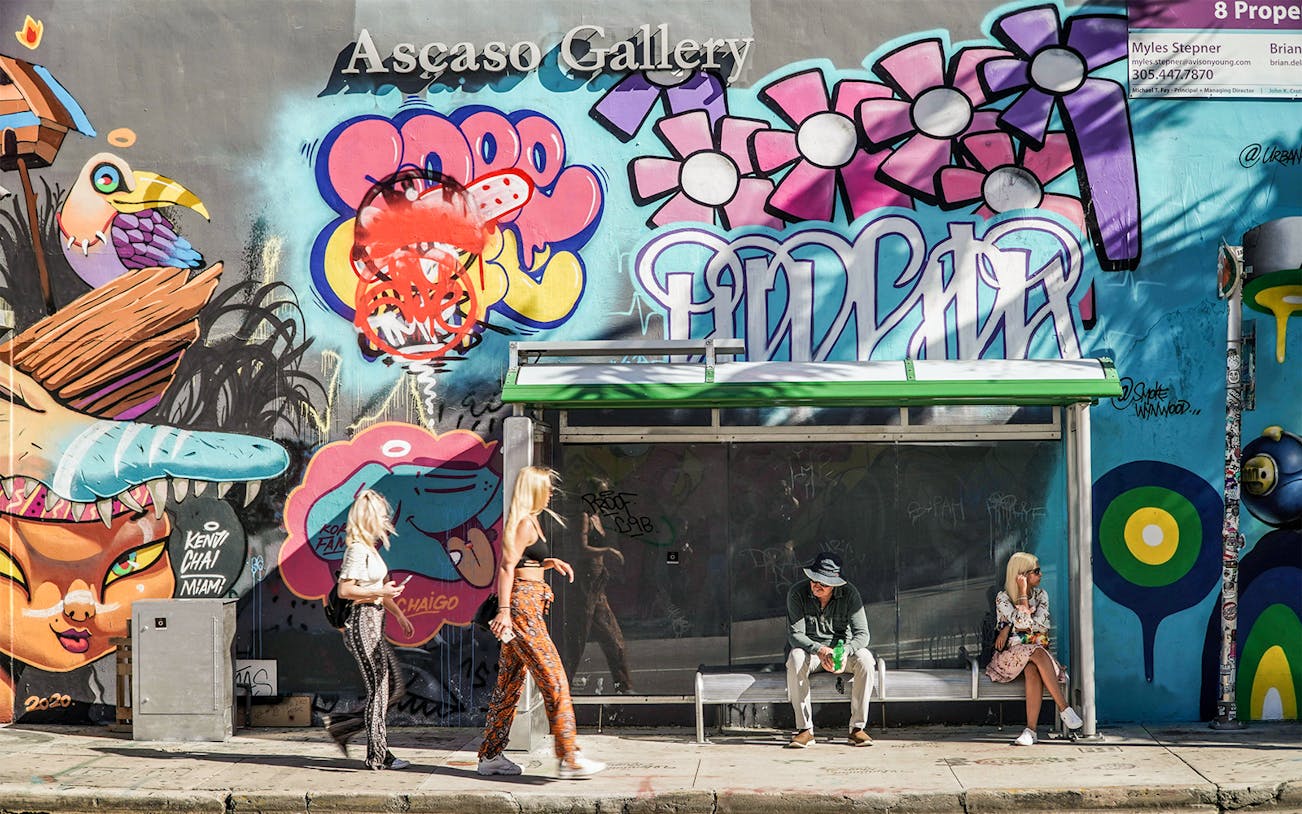Wynwood Walls Miami bus stop with vibrant mural and graffiti art.