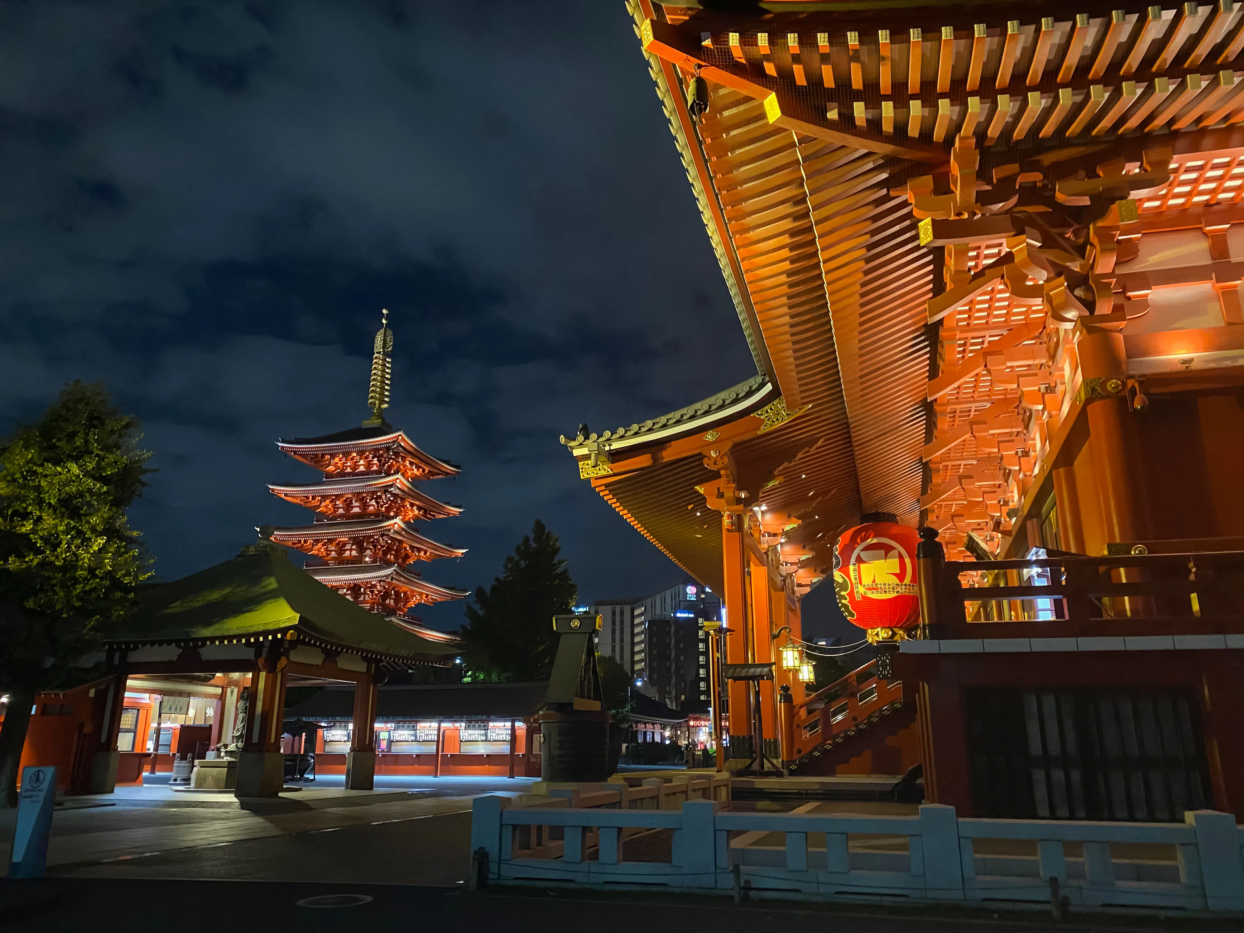 Sensoji Temple pagoda illuminated at night during Tokyo half-day tour.