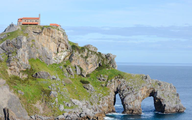 Rocky island with chapel and archway at San Juan de Gaztelugatxe, near San Sebastian.