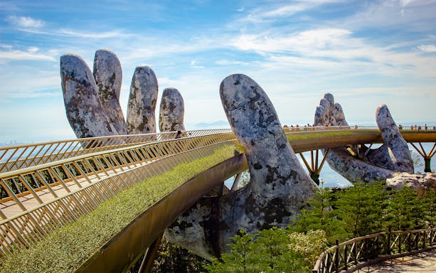 Golden Bridge held by giant hands at Ba Na Hills, Vietnam.