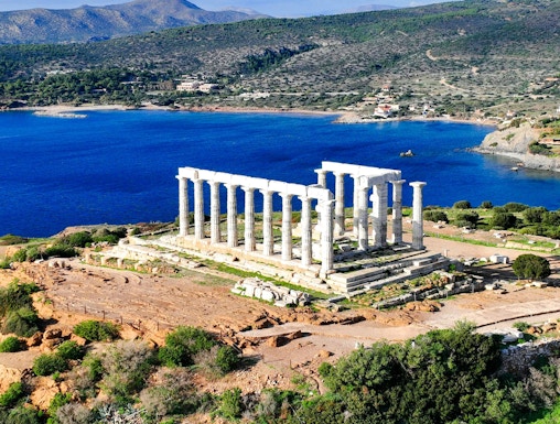 Aerial view of Temple of Poseidon at Cape Sounio, Greece, overlooking the Aegean Sea.