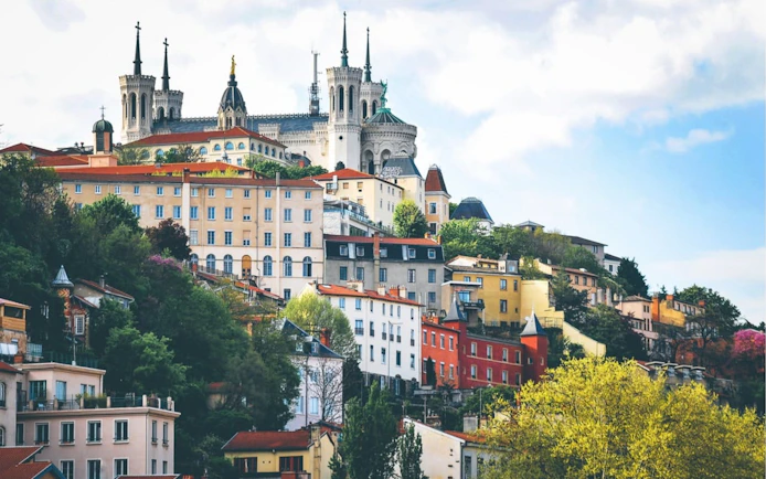 Lyon Old Town with Basilica of Notre-Dame de Fourvière on a hilltop.