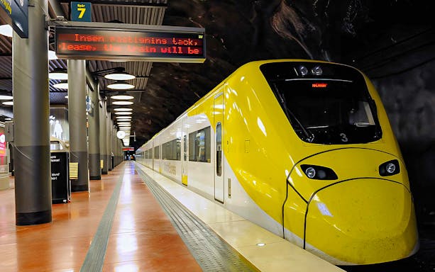 Stockholm Arlanda Express train at underground station platform.