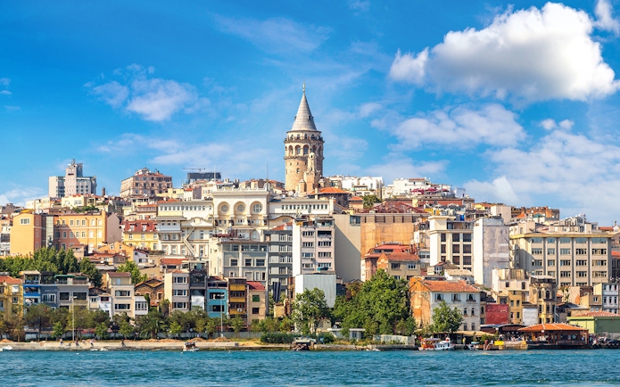 Galata Tower rising above Istanbul's historic skyline by the waterfront.