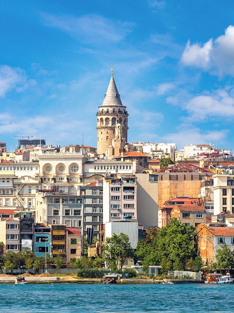 Galata Tower rising above Istanbul's historic skyline by the waterfront.
