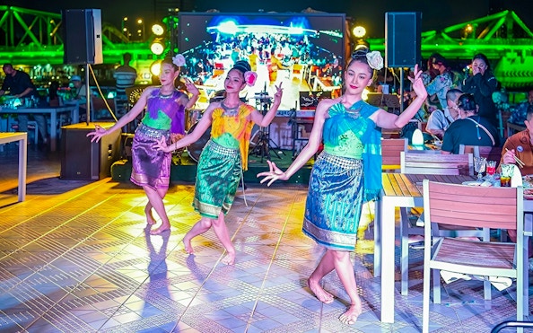 Dancers performing on the Smile Riverside Dinner Cruise with an international buffet and live show.