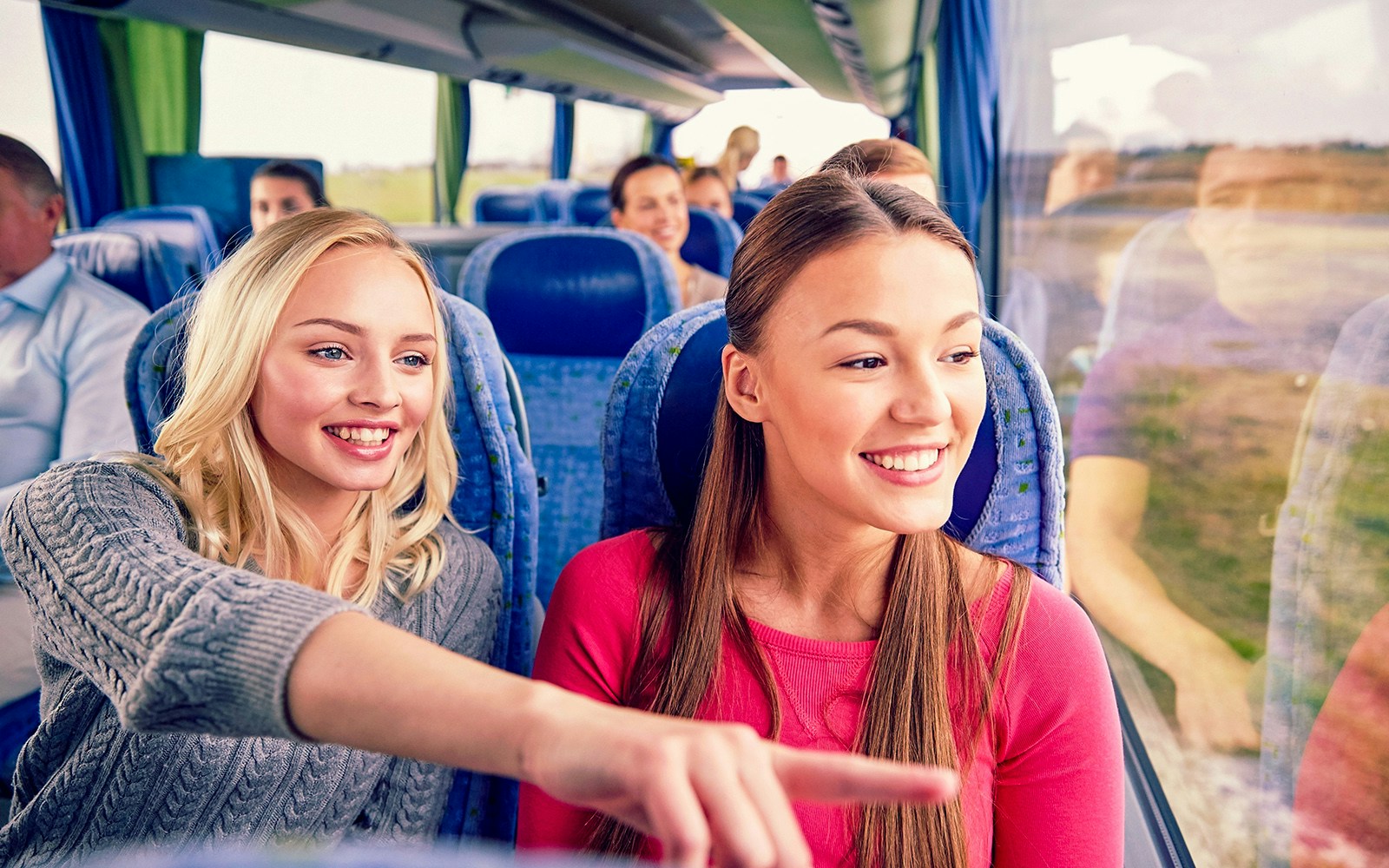 Young women enjoying a scenic bus ride in Albufera.