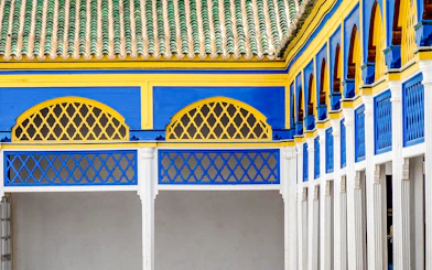 Wall tiles and colorful arches in Bahia Palace, Marrakech, Morocco.