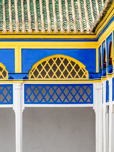 Wall tiles and colorful arches in Bahia Palace, Marrakech, Morocco.