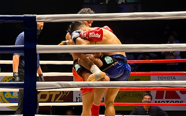 Muay Thai fighters in a clinch at World Siam Stadium, Tawanna Bangkapi.